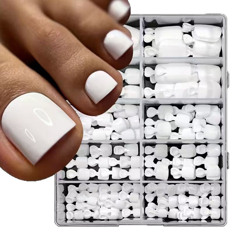White acrylic nail tips set for professional salon or home use. Essential beauty supplies for perfect DIY manicures.
