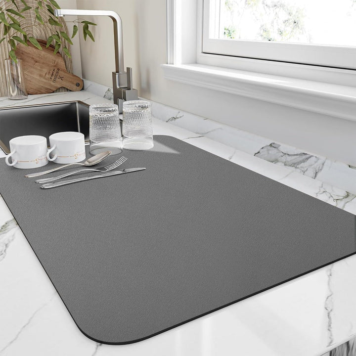 Absorbent microfiber dish drying mat. Quick-dry technology protects kitchen countertops from water.