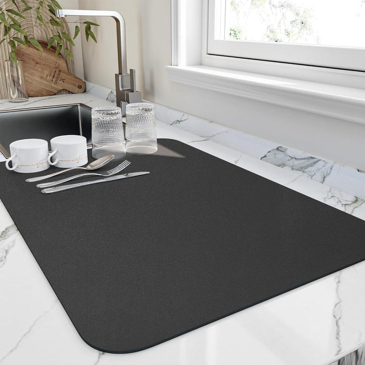 Kitchen quick-dry dish mat protects countertops, providing an organized drying space for dishes.
