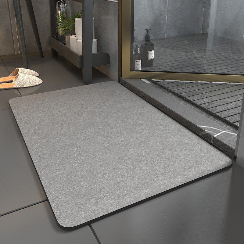 Hygienic, washable bath mat with a non-slip backing, designed for comfort and quick drying in bathrooms.