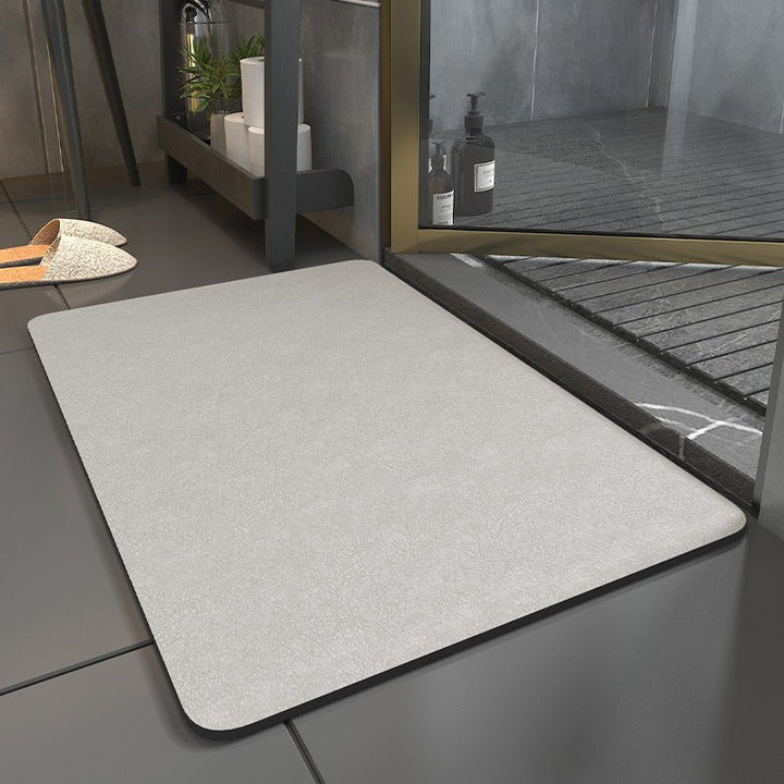 Contemporary bathroom with a non-slip, quick-dry bath mat enhancing decor and ensuring safety.