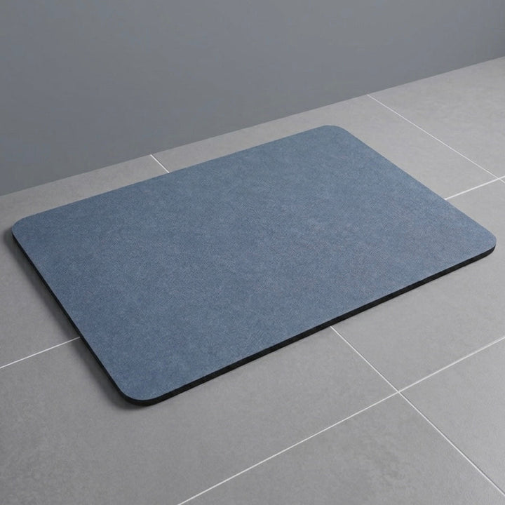 Comfortable quick-dry bath mat in a neutral color, perfect for modern bathrooms, offering safety and absorbency.