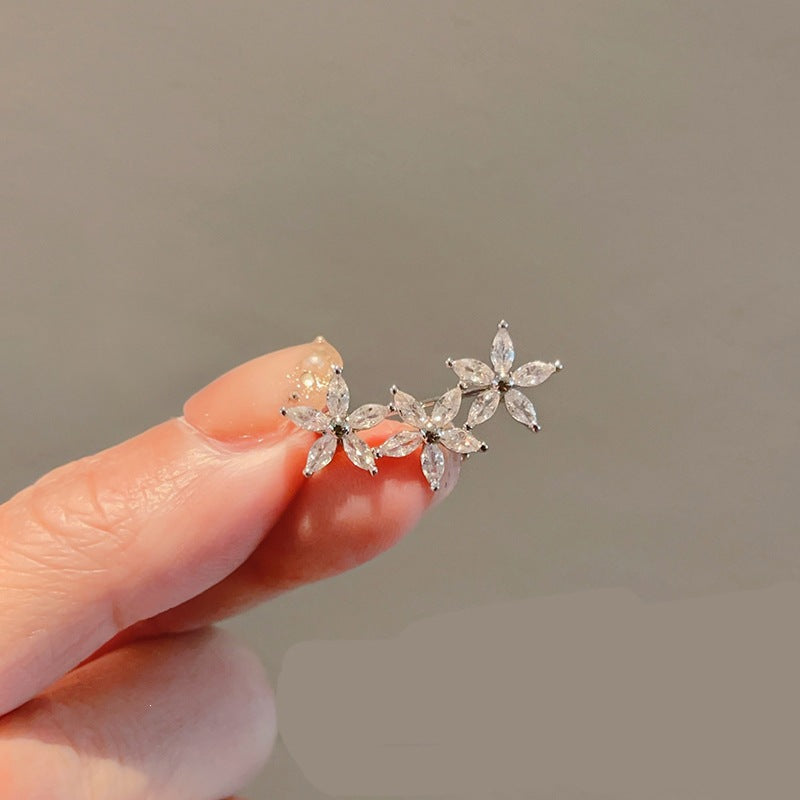 Elegant women's flower brooch with colorful gemstones, perfect sparkling jewelry accessory.
