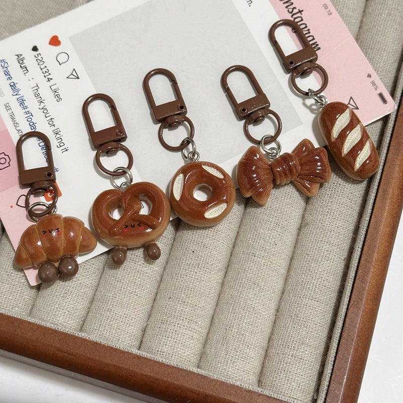 Realistic mini bread loaf keychain, perfect foodie gift & bag charm for food lovers.