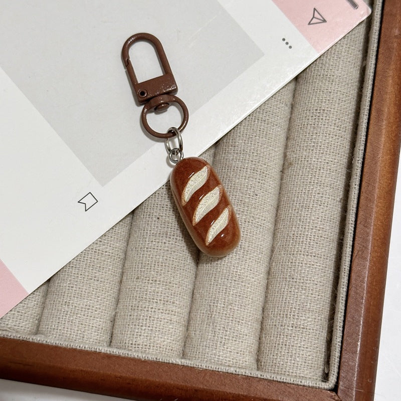Charming bread design keychain, ideal unique accessory for keys, bags, or gifts.