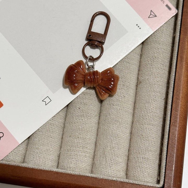 Detailed bread loaf keychain, perfect as a stylish bag charm or foodie gift idea.