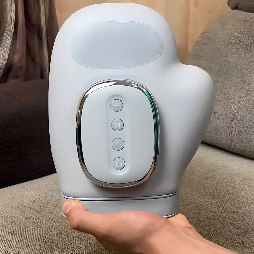 Ergonomic rechargeable hand massager provides hand therapy with soothing heat and air compression.