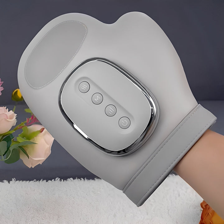 Portable hand massager for home spa relaxation, offering wrist and palm relief with heat & compression.
