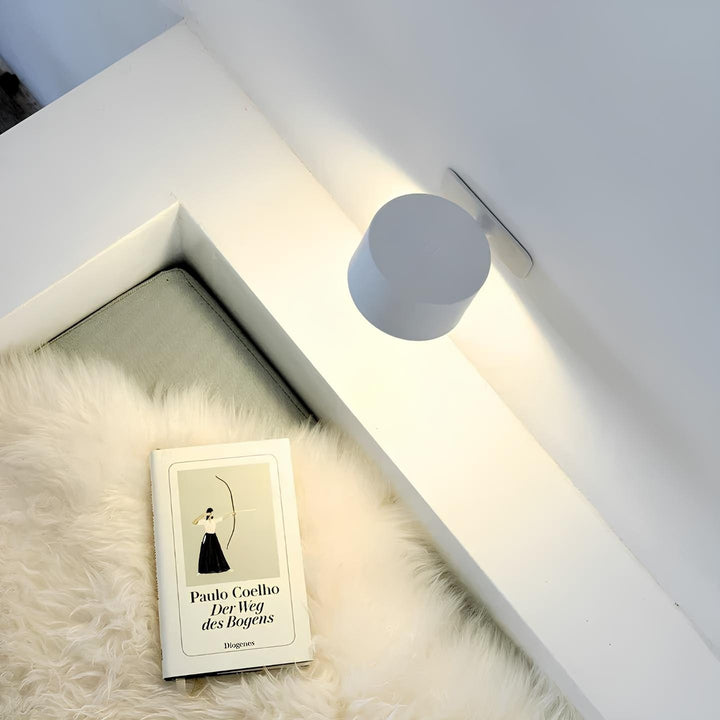 Rechargeable wireless LED wall lamp with adjustable brightness, perfect for modern home decor.