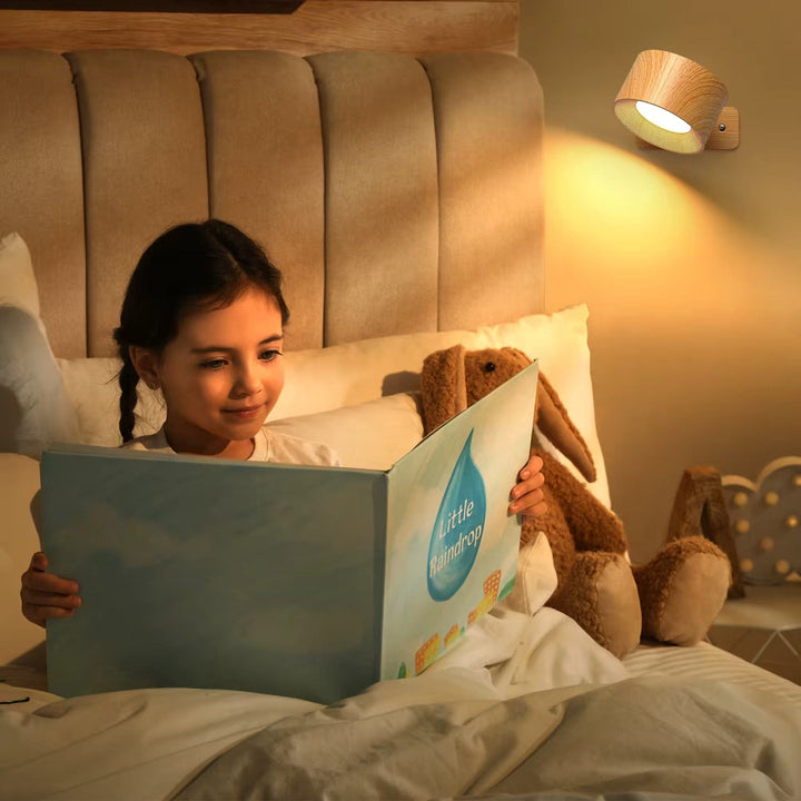 Minimalist wireless LED wall light, rechargeable, adjustable design for modern homes.