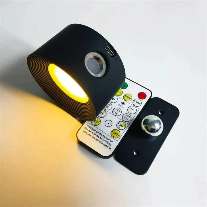 Modern LED wall lamp, wireless & rechargeable, with adjustable head for focused task lighting.