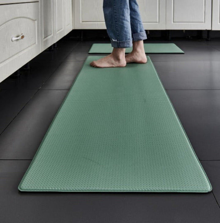 Modern light grey comfort mat, cushioned & anti-fatigue, a non-slip kitchen accessory for enhanced safety.