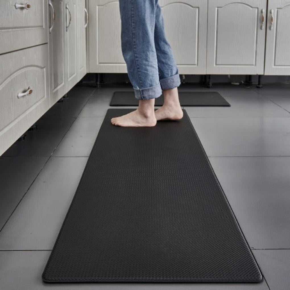 New green anti-fatigue standing mat. Cushioned, non-slip & water-resistant for maximum kitchen comfort & safety.