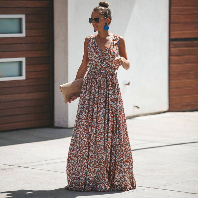 Flowy tiered red floral maxi dress with V-neck for women, ideal as a summer holiday or elegant casual dress.