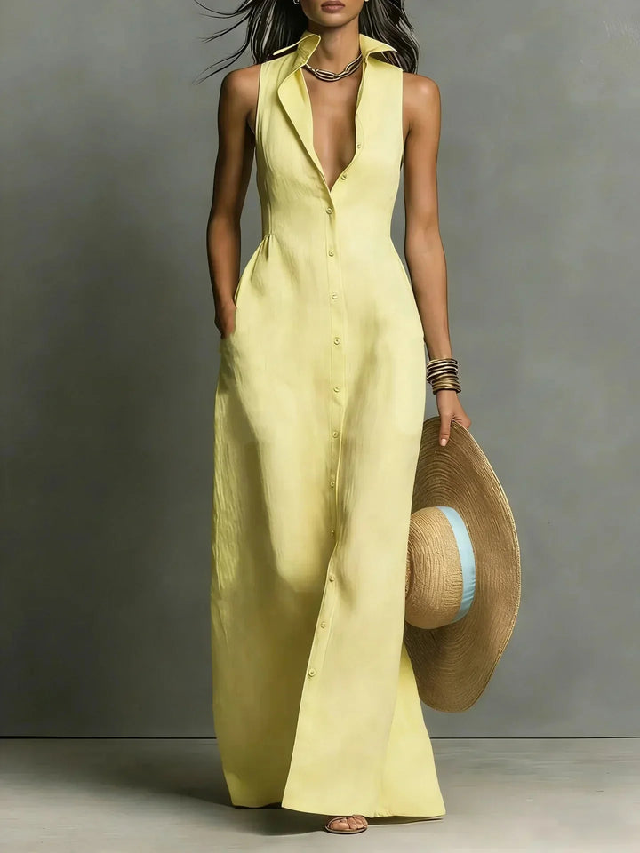 Stylish long red sleeveless dress with a button-down design, collared V-neck, and functional pockets.