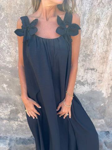 Black elegant U-neck maxi dress with bow straps, a comfortable choice for summer parties.