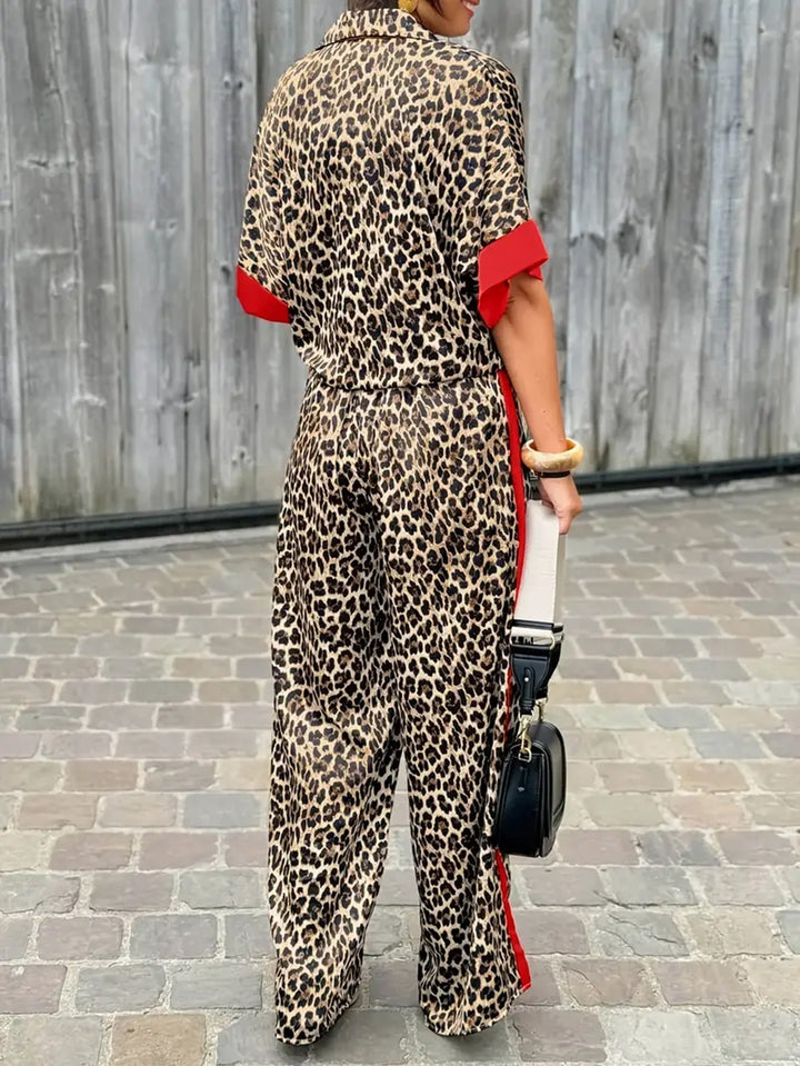 Black women's two-piece set: elegant collared top & wide-leg trousers. Versatile & stylish outfit.