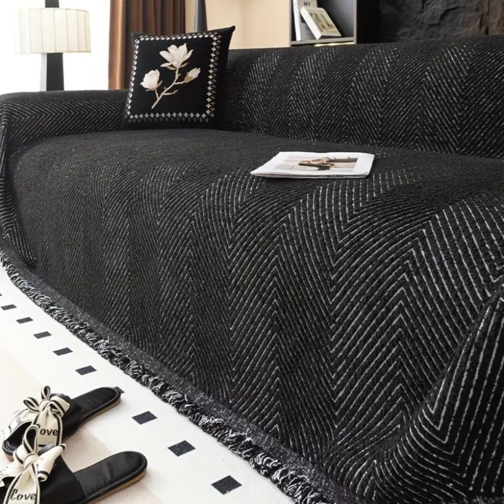 Reversible herringbone couch cover in a neutral tone, protecting your sofa. Ideal living room furniture protector.