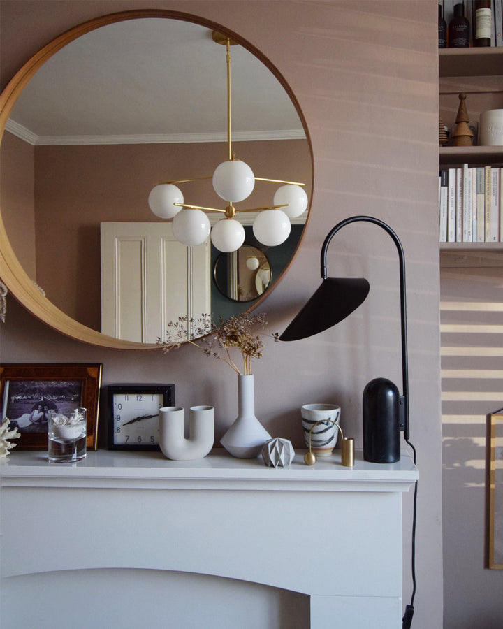 Contemporary Reyaris lamp, arch design, adds a touch of modern luxury.