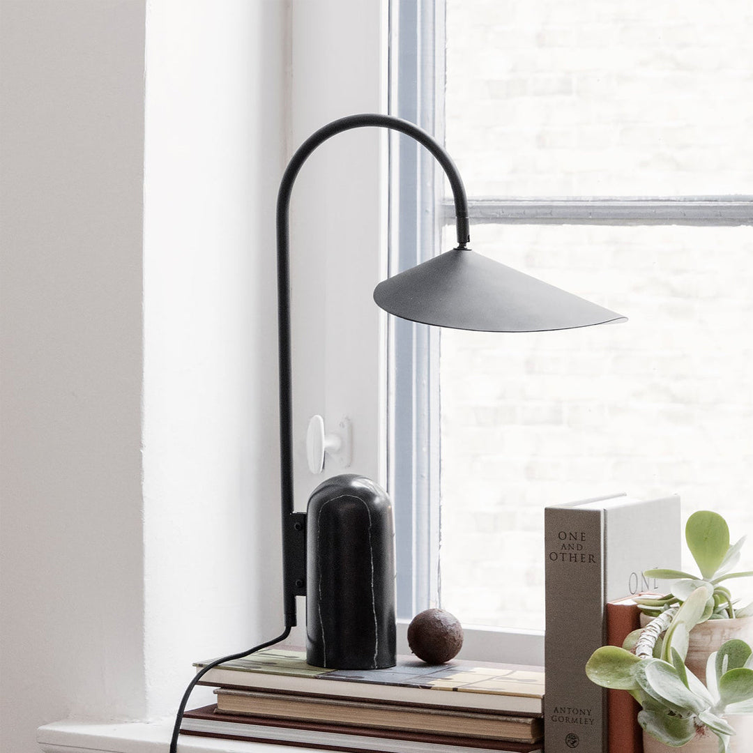 Sleek Reyaris modern arch lamp, task lighting for desk or bedside.