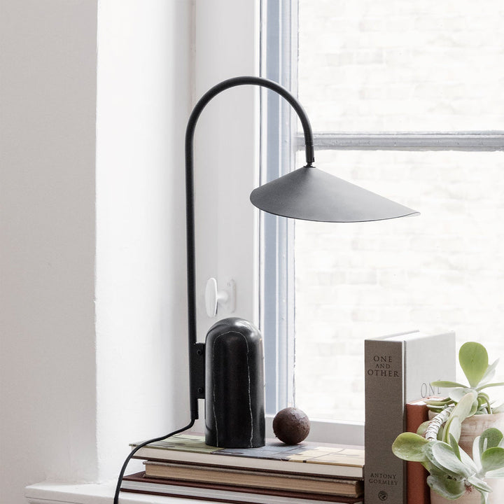 Sleek Reyaris modern arch lamp, task lighting for desk or bedside.