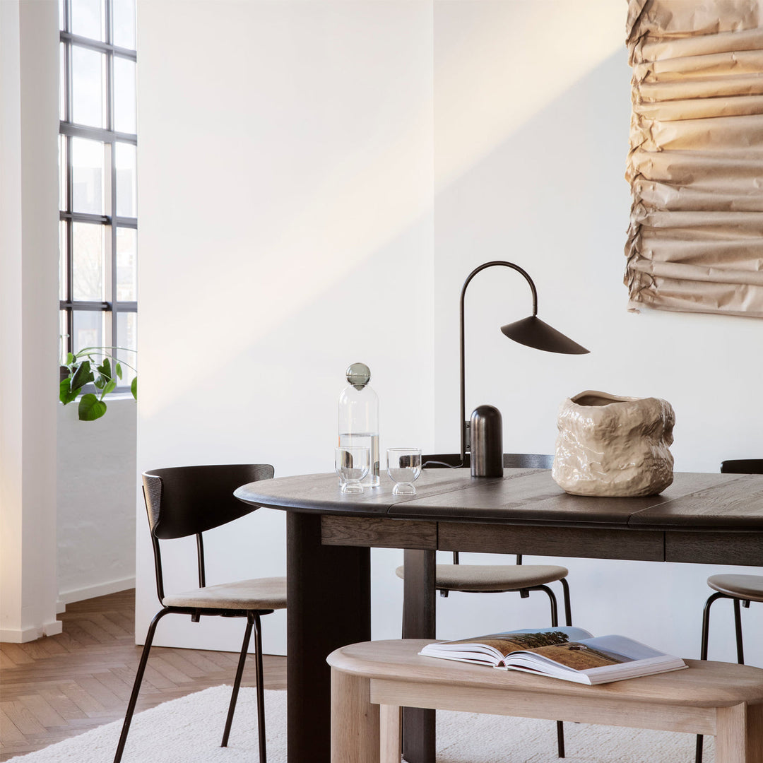 Reyaris accent lamp, modern arch design, brightens any living space.