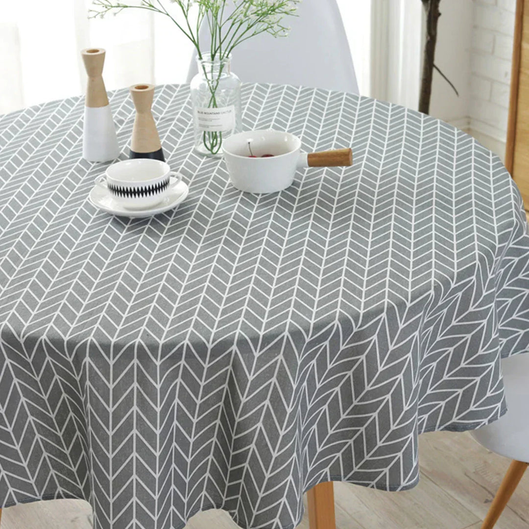 Round tablecloth with stylish herringbone pattern, perfect for elegant dining table decoration.