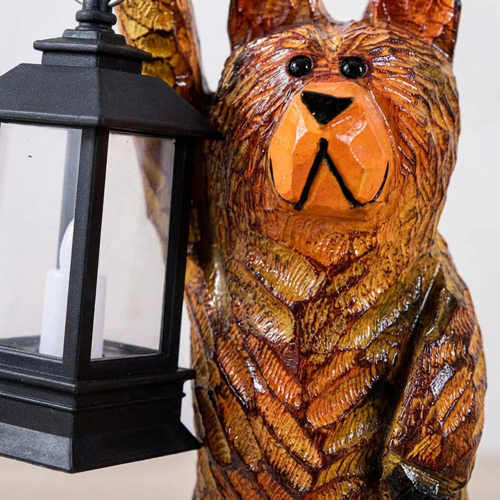 Charming bear solar garden lantern, a flickering LED outdoor light; ideal yard art & patio decor gift.