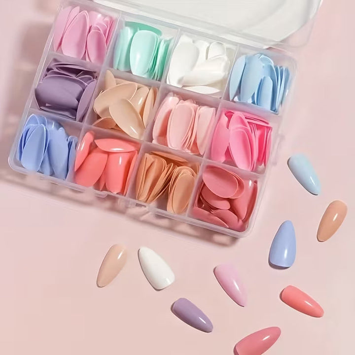 Close-up of various press-on nail art tips from a unisex salon-quality manicure kit for DIY designs.