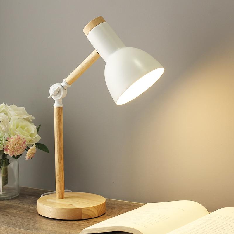 Stylish Scandinavian wooden desk lamp. Its foldable design offers modern, adjustable lighting for any room.