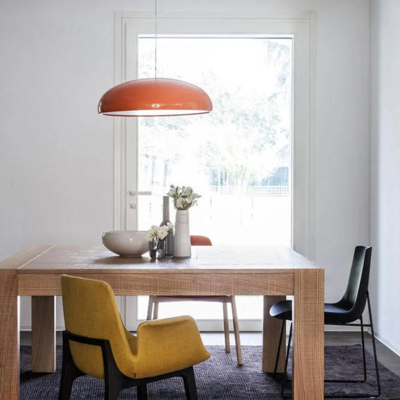 Contemporary metal LED pendant light as a stunning statement piece in a stylish living room.