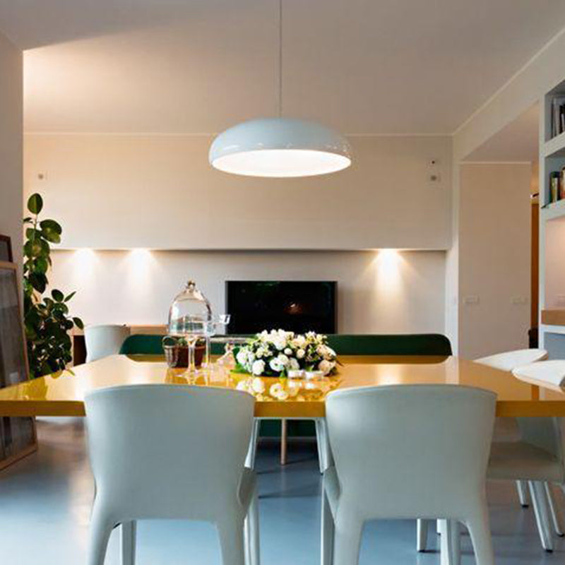 Elegant sculptural LED pendant light providing soft, adjustable lighting for a modern bedroom.
