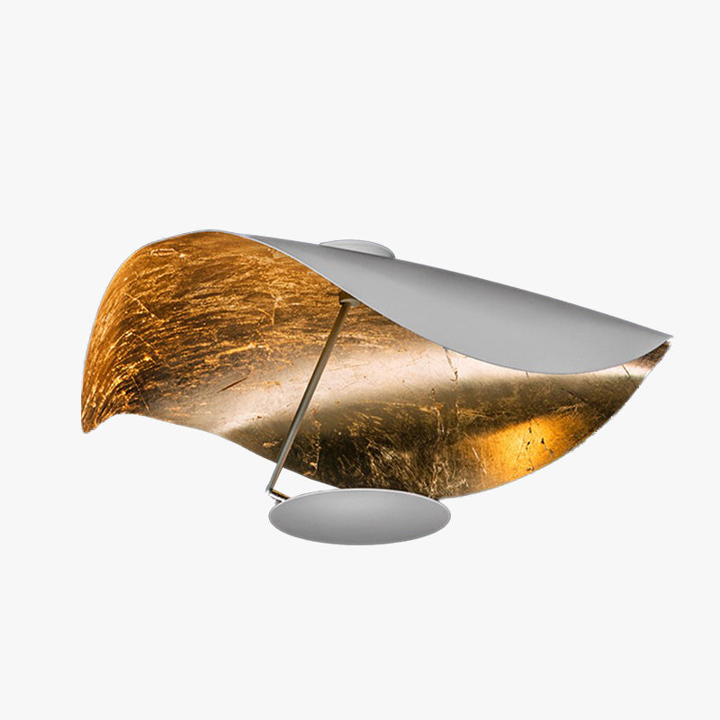 Sculptural modern leaf design pendant light in gold, perfect for contemporary living rooms.