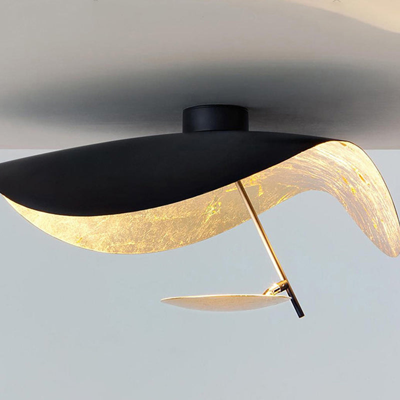 Black leaf design ceiling light, providing stylish and functional modern illumination.