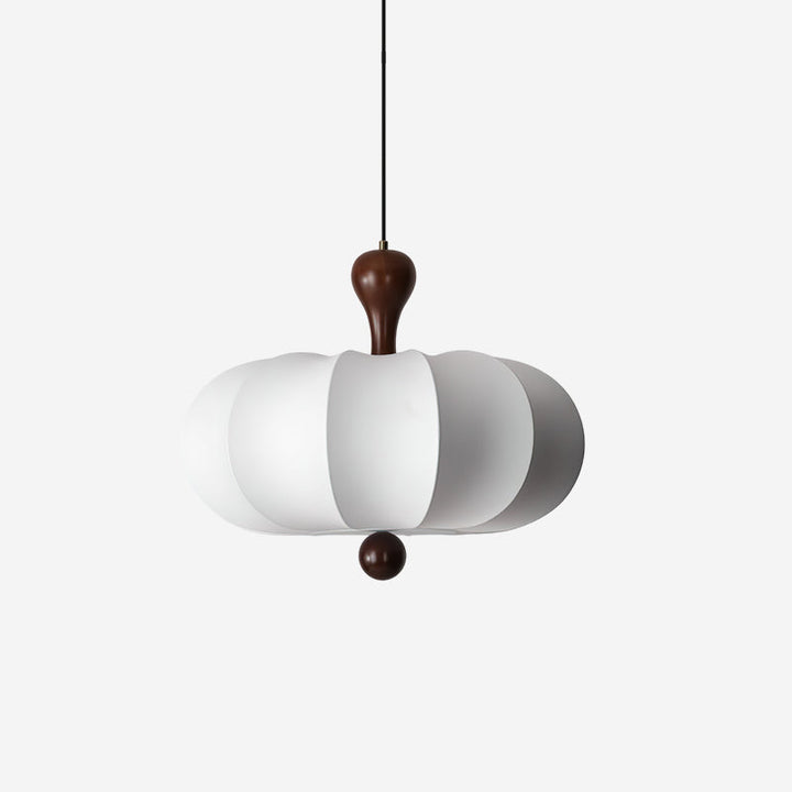 Sculptural walnut & white fabric pendant light. Modern ceiling fixture for dining/living room decor.