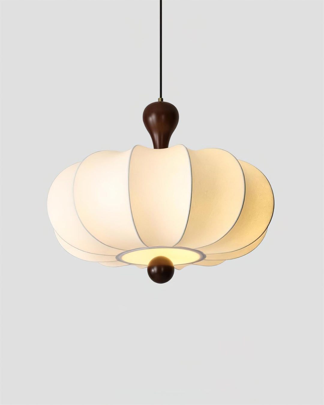 Sculptural walnut & white fabric pendant light, unlit. Showcasing modern design and materials.