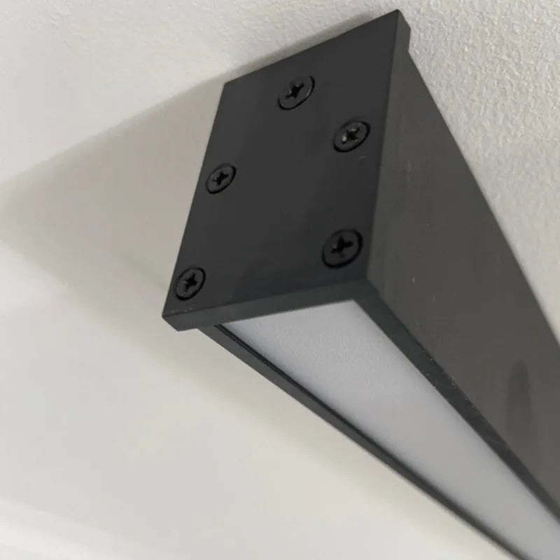 Minimalist black linear LED flush mount ceiling fixture for sleek, contemporary interior lighting.