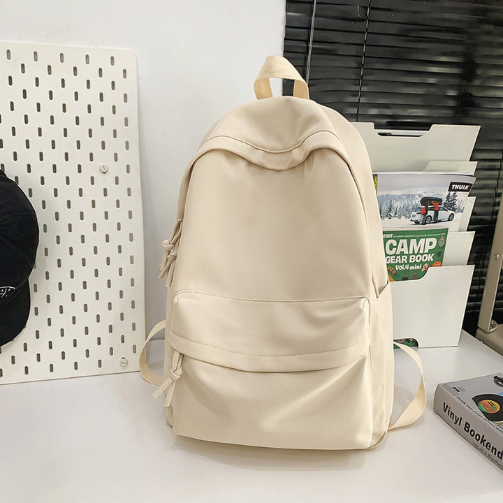 Versatile unisex minimalist black backpack. Ideal for daily commute, work, student use & travel. Spacious, durable bag.