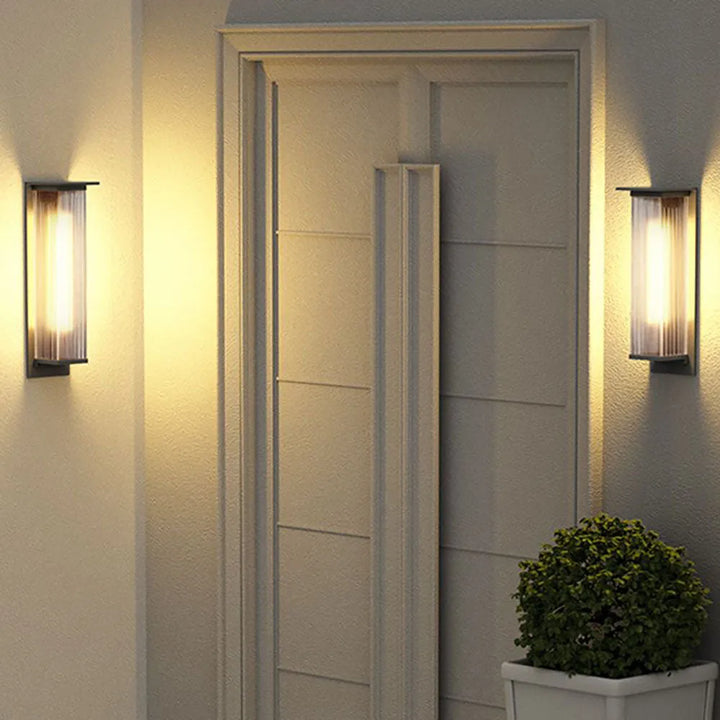 Contemporary black waterproof outdoor wall lamp with LED for patio and garden lighting.