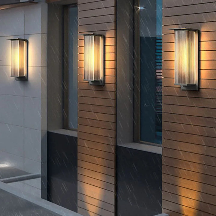 Modern LED outdoor wall light, sleek black waterproof design for exterior accent lighting.