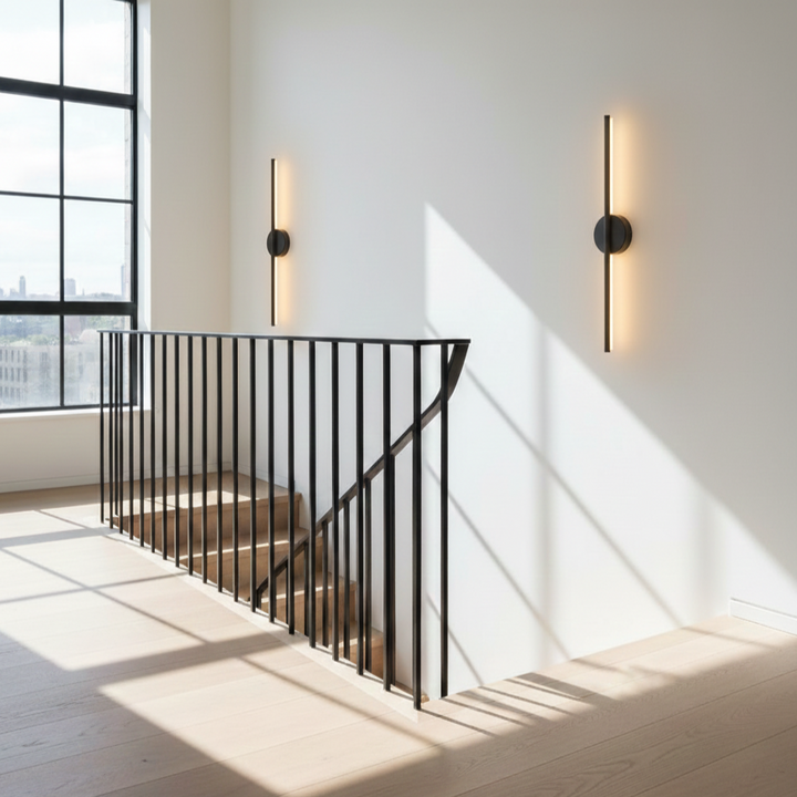 Brighten your home with this sleek black & silver modern LED wall light; energy-efficient indoor sconce.