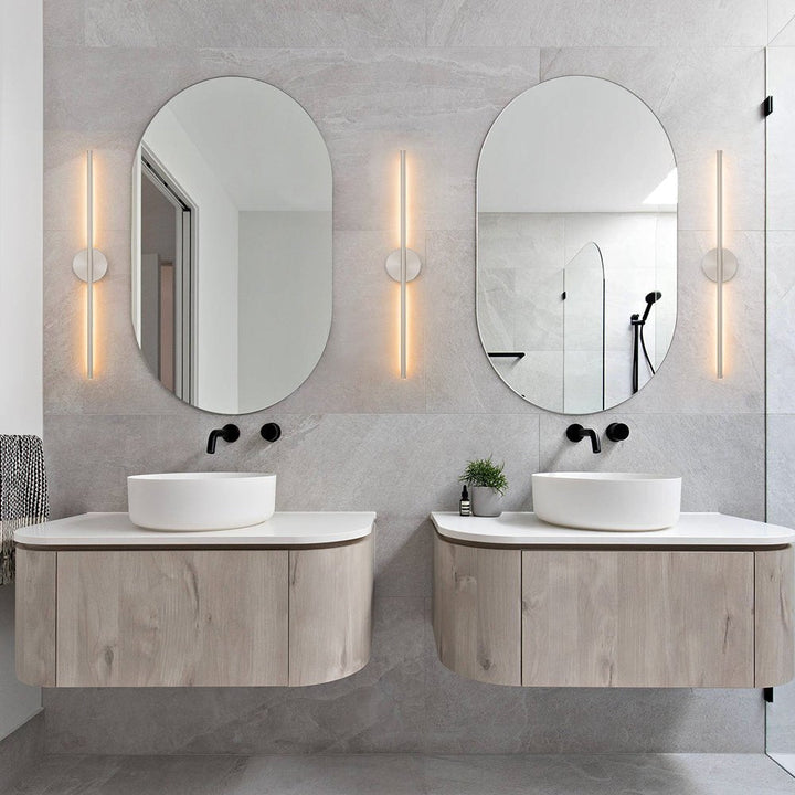 Stylish black & silver modern LED wall light, perfect for contemporary indoor spaces like hallways & bedrooms.