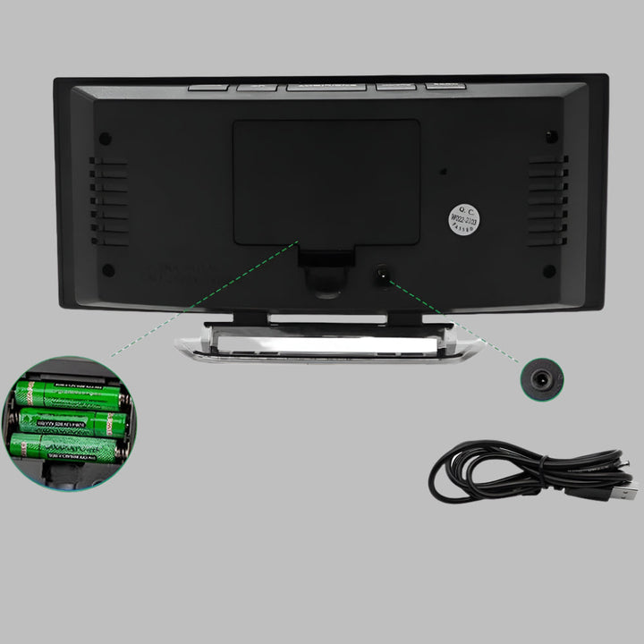 Modern desktop LED alarm clock. Curved, sleek design with digital time and snooze function.