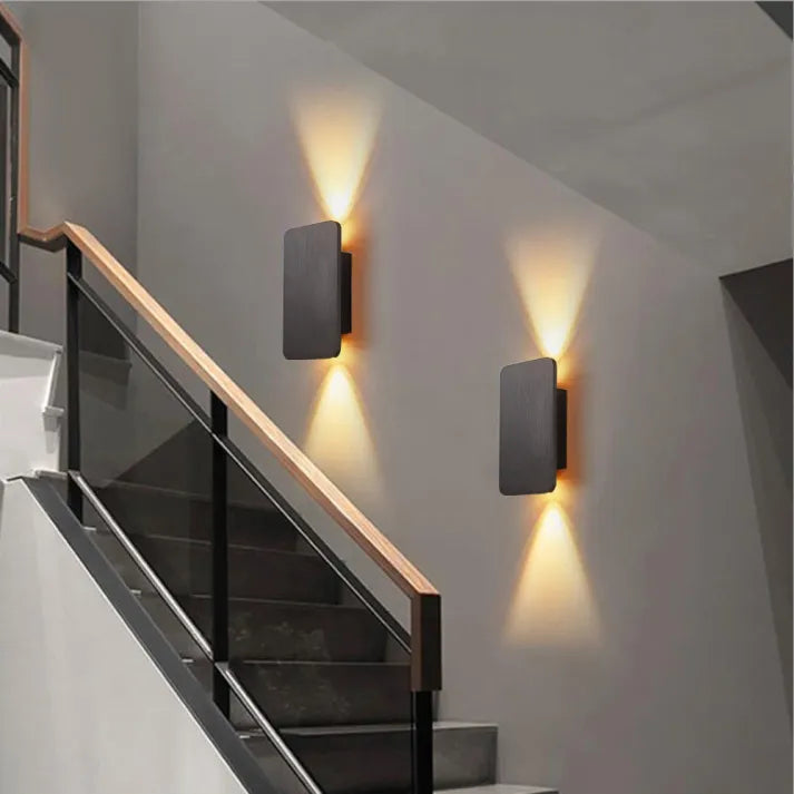 Close-up of sleek rectangular indoor LED wall lamp, highlighting modern design features.