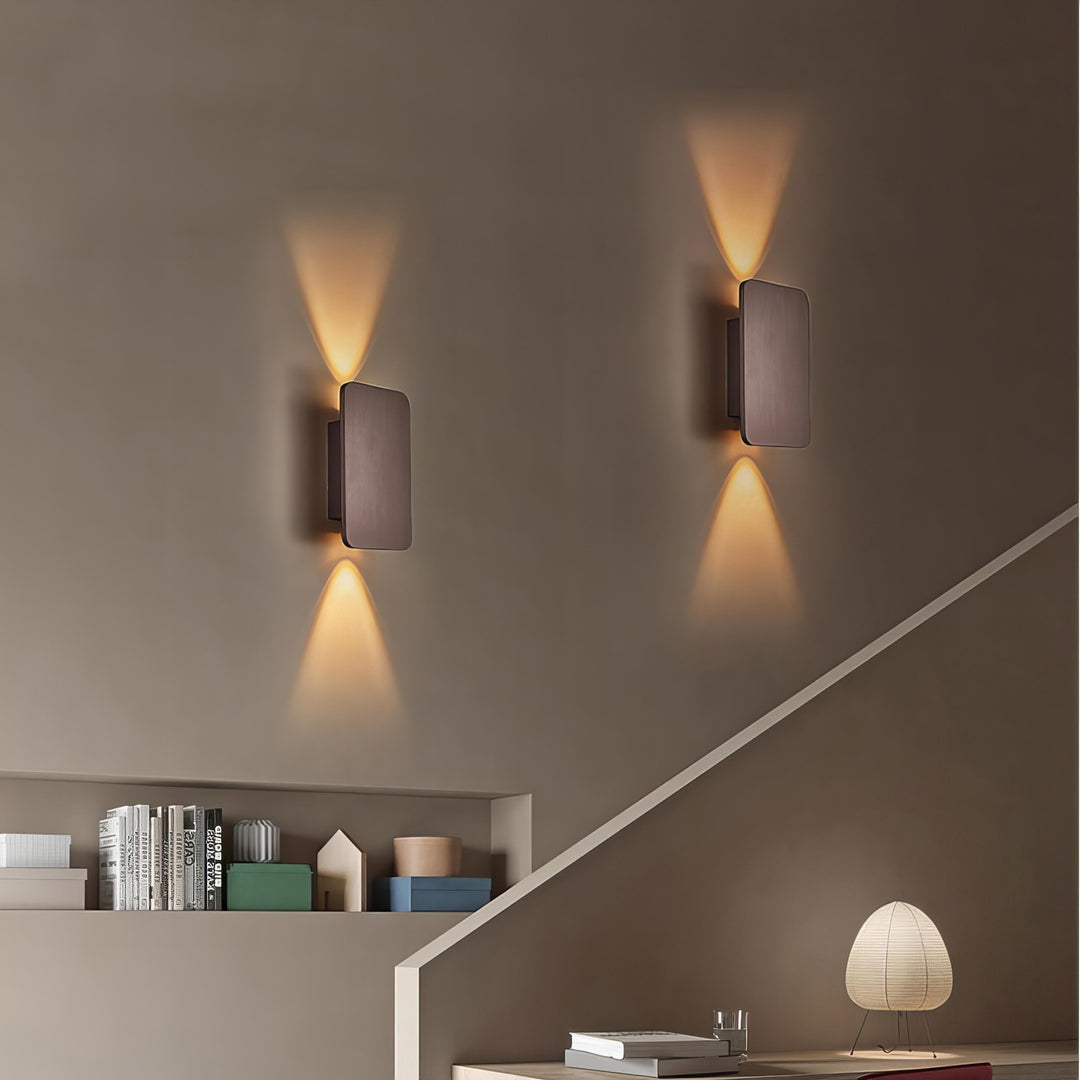 Black sleek indoor LED wall lamp, modern rectangular design for dramatic accent lighting.