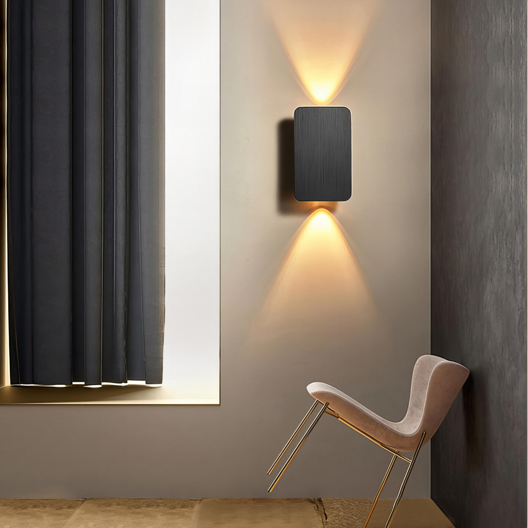 Contemporary indoor LED wall lamp, sleek rectangular form factor for modern living spaces.