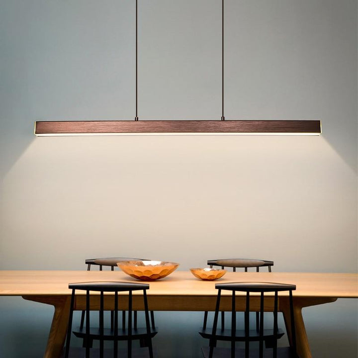 Modern linear pendant light with sleek design; ideal for living room decor.