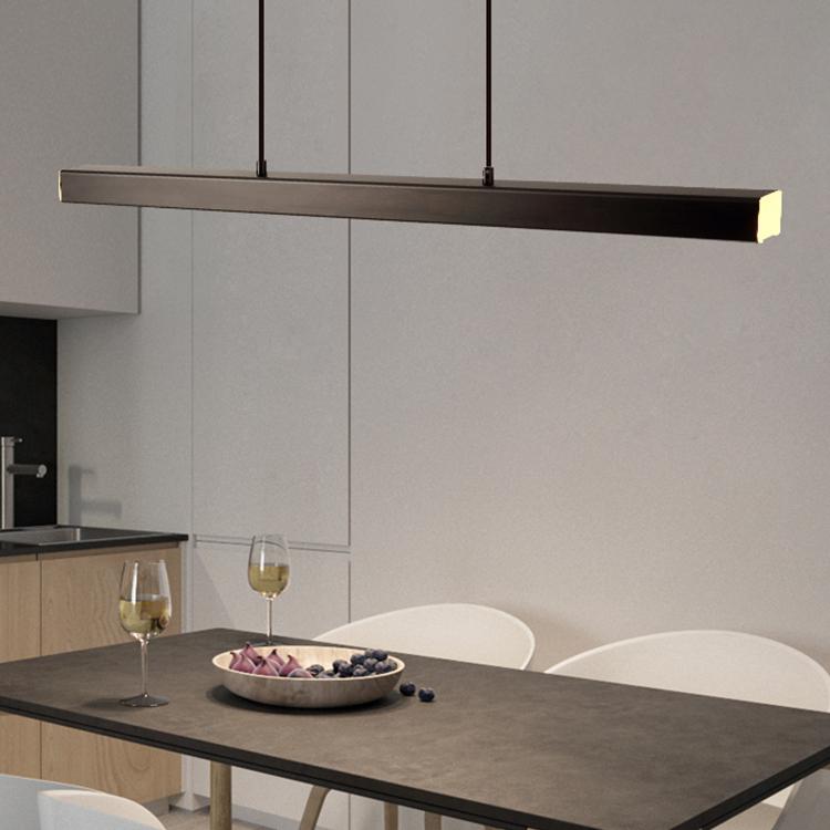 Minimalist linear pendant lamp for kitchen island; adjustable brightness.
