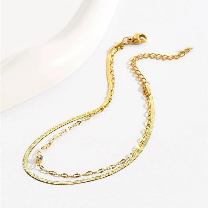 Delicate silver chain anklet, a chic minimalist foot accessory for women, ideal for summer outfits.