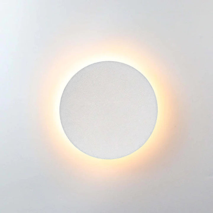 Modern LED wall lamp for outdoor use, adding a sleek touch to any exterior.